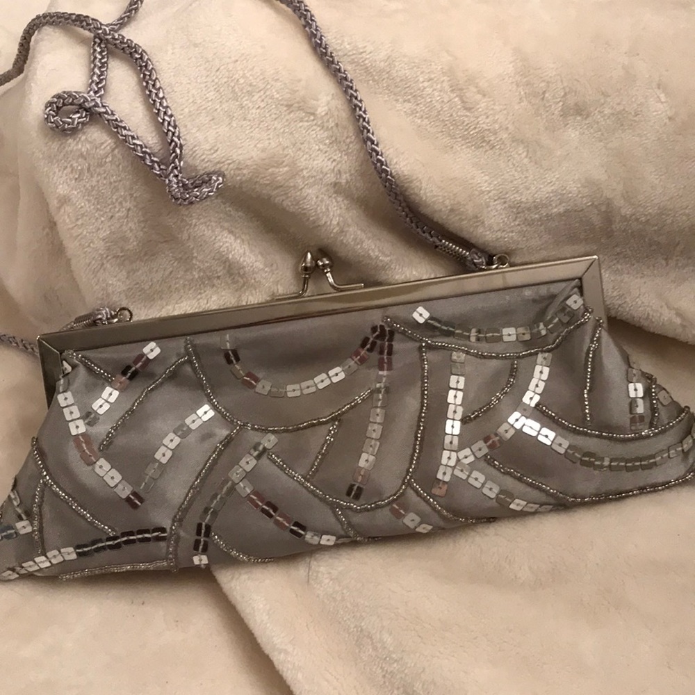 Silver sequin clutch bag.